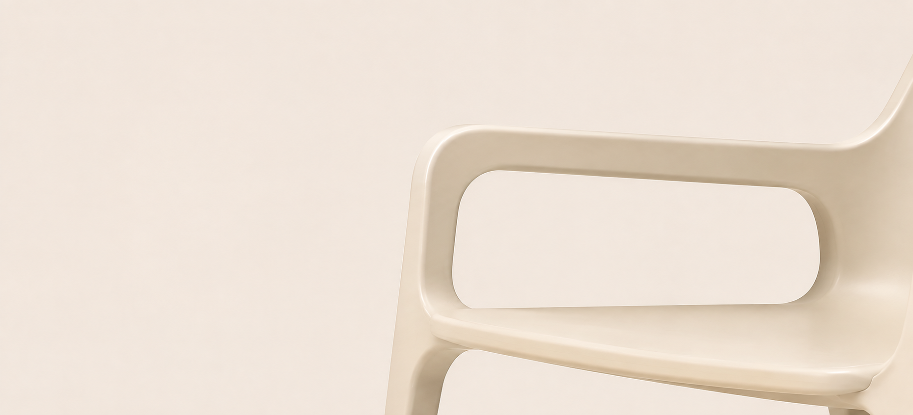 Close detail of a continuous ivory chair armrest and seat