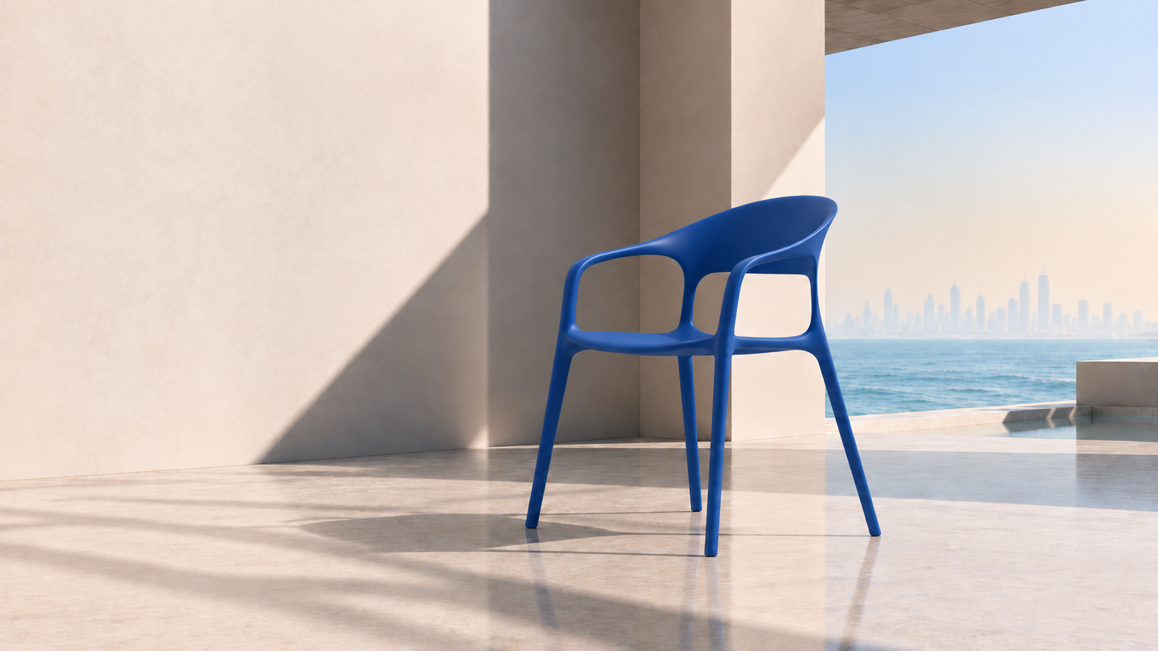 Blue sculptural chair in sunlit architecture by the water